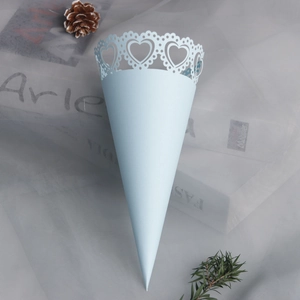 Detail of light blue laser-cut heart pattern wedding confetti cone with floral lace edge