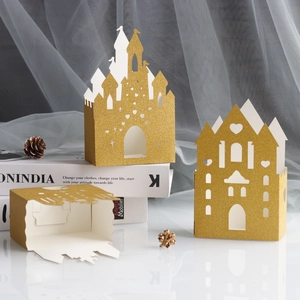 Golden glitter castle candy box with intricate laser-cut hollow design for weddings