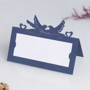Detailed laser-cut hollow lovebirds and heart pattern on navy blue wedding place cards