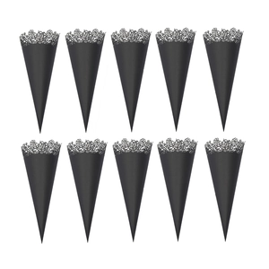 Close-up of black wedding confetti cones with delicate laser-cut rose patterns