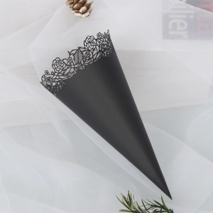 Detailed laser-cut rose patterns on elegant black paper wedding confetti cones