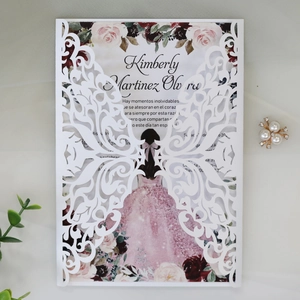 Intricate laser-cut butterfly invitation cover with elegant floral printed insert card