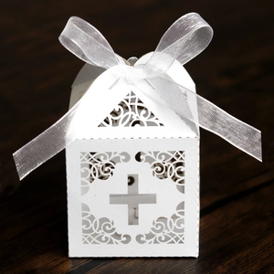 Detailed laser-cut white wedding gift box with cross pattern and elegant organza ribbon