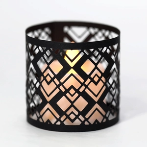 Modern black geometric hollow paper lantern with glowing LED electronic candle inside