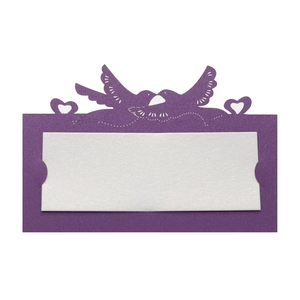 Detail of laser-cut purple bird and heart place card with white paper insert