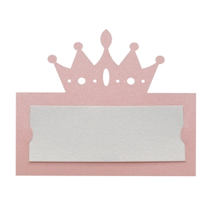 Detailed view of pink pearlescent crown place card with white insert for guest names