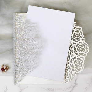 Detailed laser-cut silver glitter rose wedding invitation with elegant hollow patterns