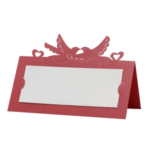 Detailed view of red hollow heart and lovebirds laser-cut wedding name place card