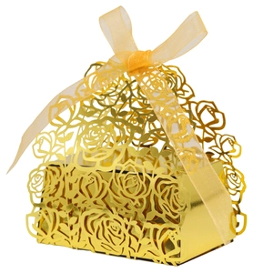 Detail of mirror gold laser-cut rose pattern gift box with yellow organza ribbon