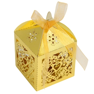 Detailed laser-cut heart and floral hollow patterns on a gold candy gift box with ribbon