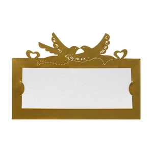 Detail of laser cut golden lovebirds and heart design on white wedding place card