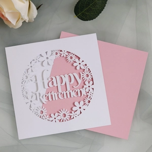 Detail of laser-cut Happy Retirement card with floral daisy patterns and pink lining