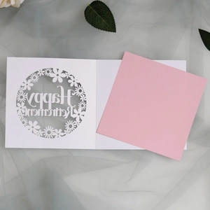 Laser-cut white retirement invitation card with pink insert and floral design