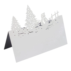 3D laser-cut white Christmas place card with snowman and forest trees on white background