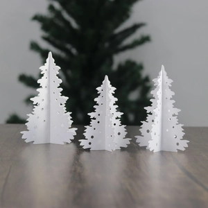 Set of three white 3D cutout paper Christmas trees for festive tabletop decoration