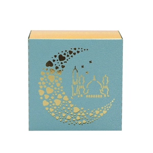 Detail of light blue pearl paper candy box with laser-cut gold mosque and heart moon