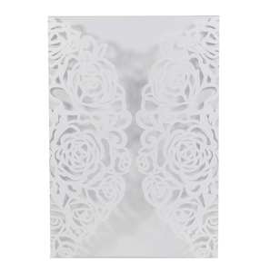 Macro detail of white laser-cut rose floral pattern on high-quality pearlescent paper
