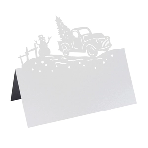 White laser-cut Christmas place card featuring snowman and vintage truck with tree