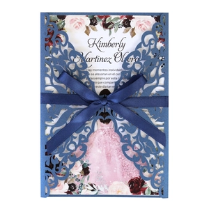 Navy blue laser-cut hollow invitation with a satin ribbon bow and elegant floral inner card