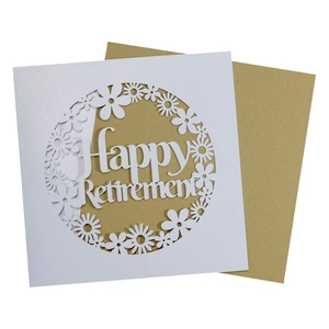 Detail of laser-cut Happy Retirement card with daisy patterns and kraft envelope