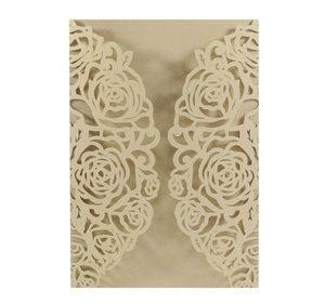 Detailed laser-cut rose floral texture on champagne gold wedding invitation card