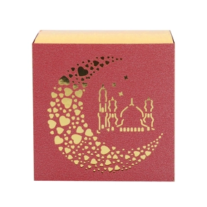 Macro view of red 3D hollow Eid Mubarak gift box with gold moon and mosque patterns