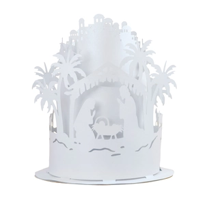 Macro detail of the white 3D paper-cut nativity scene with Mary, Joseph, and Jesus