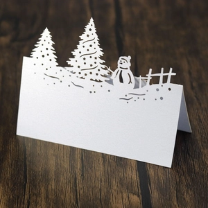Laser-cut white snowman and Christmas tree standing table card with pearlescent finish