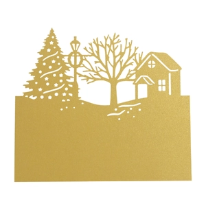 Macro shot of laser-cut gold pearlescent Christmas tree and house tabletop place card
