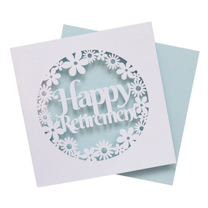 Detailed laser-cut Happy Retirement card with floral pattern and soft green envelope