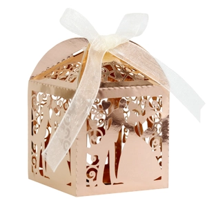Detail of rose gold laser-cut wedding candy box with bride and groom silhouette