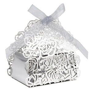 Detail of silver laser-cut rose hollow candy box with elegant silk ribbon bow