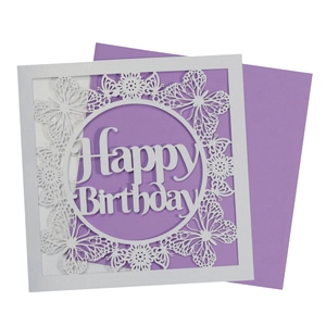 Macro view of laser-cut butterfly card with Happy Birthday text and purple envelope