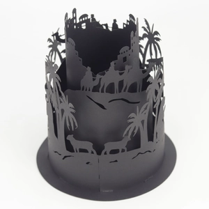 Detail of black laser-cut lantern sleeve with camel, palm tree and castle silhouettes