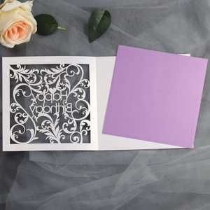 Laser-cut white floral hollow birthday card with purple insert on grey mesh