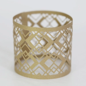 Detail of laser-cut gold hollow pattern decorative ring for party candle lighting décor