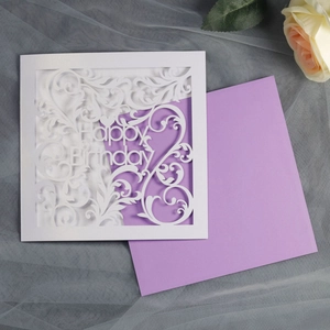 Detail showing laser-cut floral pattern and Happy Birthday text on white greeting card