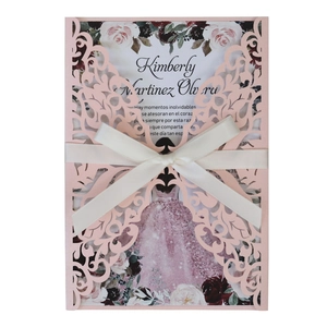 Elegant laser-cut pink wedding invitation with butterfly lace and satin bow ribbon