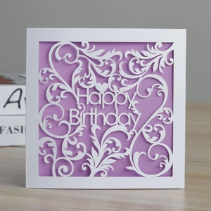 Detailed laser-cut floral pattern with Happy Birthday text on white and purple card