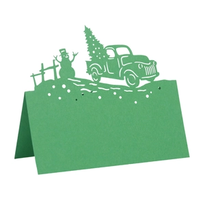 Laser-cut 3D Christmas table card featuring green snowman and tree silhouette