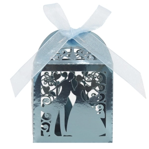 Close-up of laser-cut metallic blue wedding favor box with bride and groom silhouette