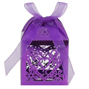Close-up of purple laser-cut heart candy box with an elegant matching ribbon bow