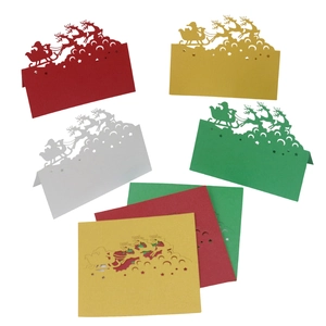 Laser cut 3D Christmas table cards with reindeer and Santa in red gold white and green