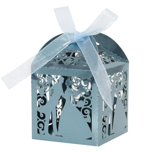 Detail of laser-cut wedding favor box in light blue metallic finish with ribbon