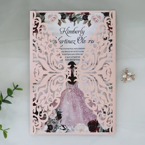 Close-up of pink laser-cut butterfly invitation card with floral girl illustration