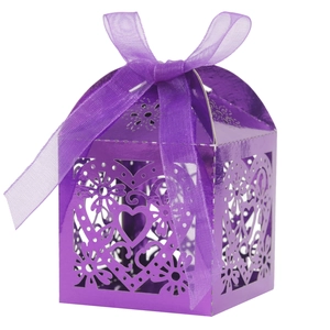 Close-up of laser-cut purple heart pattern candy box with a decorative organza ribbon