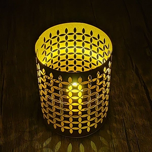 Cylindrical hollow paper lampshade with laser-cut floral patterns and warm yellow light
