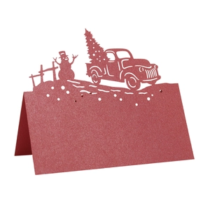 Laser-cut red Christmas snowman and car table card made of shimmering specialty paper