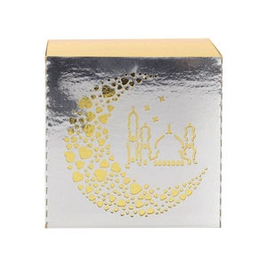 Macro detail of silver Eid Ramadan candy box with golden crescent and mosque patterns