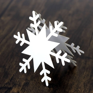 3D white snowflake place card made of paper for winter table settings and Christmas decor